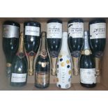 Nine bottles of assorted sparkling wine.