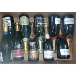 Nine bottles of assorted sparkling wine.