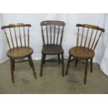 Two beech penny seat chairs having stick backs, standing on turned supports with stretchers - 40cm x