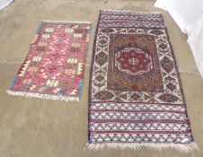 Two Kilim rugs, one having beige ground with blue, brown and red geometric patterns - 0.84m x 1.