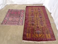 Red and brown ground rug with geometric patterns - 0.95m x 1.69m together with a Kilim rug having