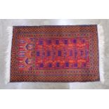 Dark red ground prayer rug with geometric pattern and end tassels - 0.80m x 1.40m Please note