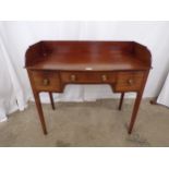 George IV mahogany bow fronted dressing/writing table having 3/4 raised gallery over single drawer