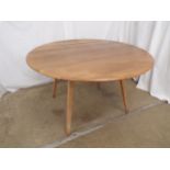 Ercol drop leaf dining table, standing on splayed tapering supports - 66cm x 113cm x 72cm tall