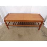 Remploy teak extending coffee table with slatted lower tier, standing on square tapering