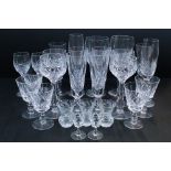 Large collection of glassware to include red and white wine glasses, champagne flutes, tumblers,