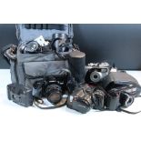 Group of 35mm film cameras, lenses and accessories to include Canon AE1 SLR, Olympus OM10, Minolta