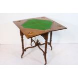 Late 19th century mahogany envelope card table, having central frieze drawer with open fretwork to