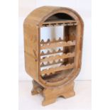 Mid 20th century pine wine rack, having ovoid form with four storage racks. Measures H 121cm x W