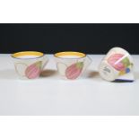 Three Wedgwood teacups from the 'Clarice Cliff Collection', each inscribed 'Bizarre by Clarice