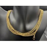 A VICTORIAN LONG GUARD CHAIN 9CT 58” 16.3 GMS