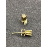 A pair of diamond stud earrings