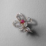 A VICTORIAN RUBY AND DIAMOND BOW BROOCH / PENDANT, C1890, centring on a cushion-shaped ruby weighing