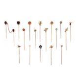 A COLLECTION OF 17 STICK PINS, comprising seventeen stick pins capped with; a rose-cut diamond in