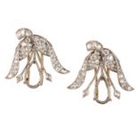 A PAIR OF DIAMOND CLIP MOUNTS, each composed of a foliate surmount pavé-set with graduated old