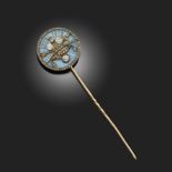 A RUSSIAN DIAMOND-SET GOLD STICK PIN, CIRCA 1912, the circular blue guilloché enamel top section