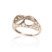 A DIAMOND-SET RING MOUNT, EARLY 20TH CENTURY, set with graduated old cushion-shaped diamonds in