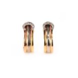 CARTIER, A PAIR OF DIAMOND-SET 'C DE CARTIER' EARRINGS, both designed with a ribbed bi-colour gold