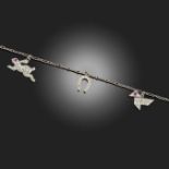 AN ART DECO CHARM BRACELET, the oval-link platinum bracelet suspending three gem-set charms