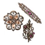 THREE GEM-SET SILVER AND GOLD BROOCHES, comprising a foliate spray brooch set with rubies and rose-