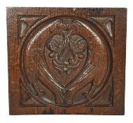 A HENRY VIII CARVED OAK PANEL C.1520 depicting a pair of love birds with shell spandrels 20.6 x 22.