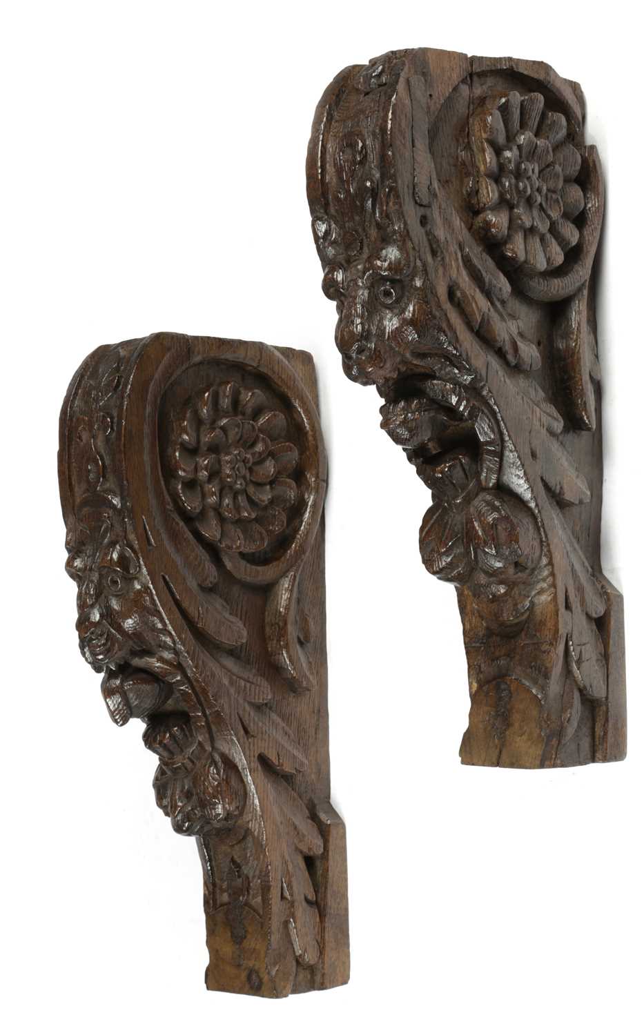 A PAIR OF CARVED OAK LION'S MASK CORBELS LATE 16TH / EARLY 17TH CENTURY ...
