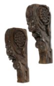 A PAIR OF CARVED OAK LION'S MASK CORBELS LATE 16TH / EARLY 17TH CENTURY decorated with flowerheads