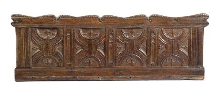A HENRY VIII OAK PANEL C.1530 consisting of four parchemin panels, with a foliate scroll top and