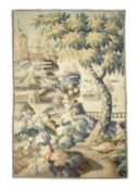 A FLEMISH TAPESTRY FRAGMENT 17TH CENTURY worked in wools and silk, depicting a coastal castle with