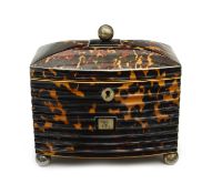 λ A REGENCY TORTOISESHELL TEA CADDY C.1815 inlaid with pewter stringing and with a ribbed bow