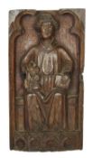 AN ENGLISH CARVED OAK PANEL OF A SAINT ENGLISH, 15TH CENTURY depicted seated holding a book in his