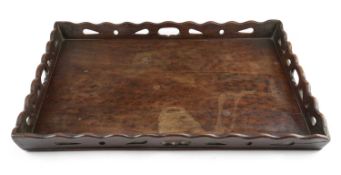 A GEORGE III MAHOGANY TRAY C.1770-80 the wavy edged gallery with pierced decoration and four
