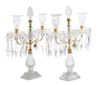 A PAIR OF REGENCY CUT GLASS AND GILT BRASS CANDELABRA EARLY 19TH CENTURY each with twin lights and