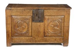 A FRENCH OAK CHEST 16TH CENTURY AND LATER the boarded top with cleated ends above a twin panelled