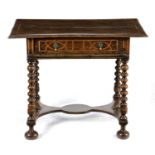 A WILLIAM AND MARY OAK SIDE TABLE C.1690 inlaid with holly stringing, the twin plank top with a