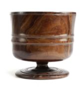A CHARLES II TREEN LIGNUM VITAE WASSAIL BOWL C.1660 with an ogee band to the body and with incised