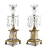 A PAIR OF GEORGE III CUT GLASS AND PORCELAIN CANDLESTICKS IN THE MANNER OF WILLIAM PARKER, C.1790-