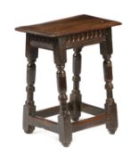 A JAMES I OAK JOINT STOOL SALISBURY, IN THE MANNER OF THE BECKHAM WORSKHOP, C.1620 the seat with a