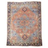 A HERIZ CARPET NORTH WEST PERSIA, C.1900 the terracotta field of angular vines, centred by sky