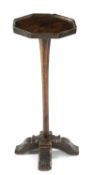 A WILLIAM AND MARY OAK CANDLESTAND LATE 17TH / EARLY 18TH CENTURY the octagonal top on a faceted