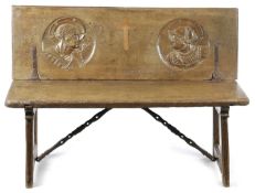 A SPANISH WALNUT BENCH / TABLE 16TH CENTURY the hinged top revealing two relief carved Romayne