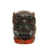 A FRENCH NOVELTY BOXWOOD BULLDOG HEAD INKWELL LATE 19TH CENTURY with inset glass eyes, black and tan