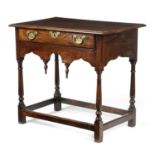A RARE WELSH OAK SIDE TABLE VALE OF GLAMORGAN, EARLY 18TH CENTURY the boarded top above a frieze