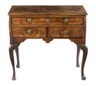 A GEORGE II WALNUT LOWBOY BY JOHN GIBSON, C.1730-40 AND LATER with cross and feather banding, the