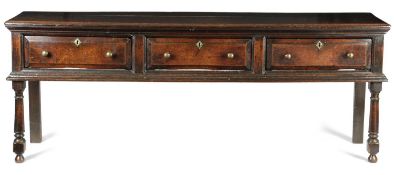 A WILLIAM AND MARY OAK DRESSER C.1700 the boarded top above three fielded frieze drawers on turned