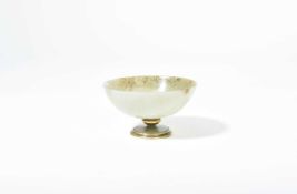A CONTINENTAL NEPHRITE FOOTED BOWL 19TH CENTURY with a gilt metal knop and foot rim 9.1cm