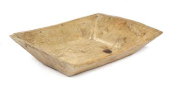 A PINE DUG-OUT BOWL 19TH CENTURY with an adzed finish 11.7cm high, 67cm wide 45cm deep