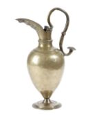 A RARE GERMAN SMALL BRASS EWER NUREMBERG, C.1580 of elegant ovoid form, with a short waist and