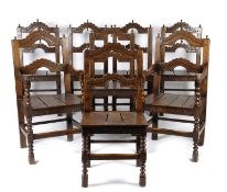 A SET OF EIGHT OAK DINING CHAIRS IN 17TH CENTURY YORKSHIRE STYLE each with a twin arched back with