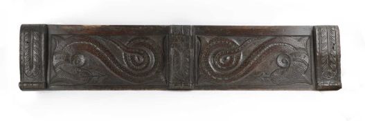 AN ENGLISH RELIEF CARVED OAK RAIL C.1600 carved with two panels of scaly dragons flanked by leaf